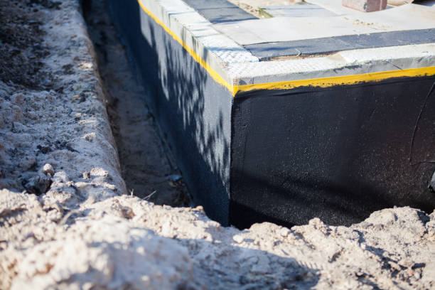 Professional Waterproofing technician working in Alexandria, AL